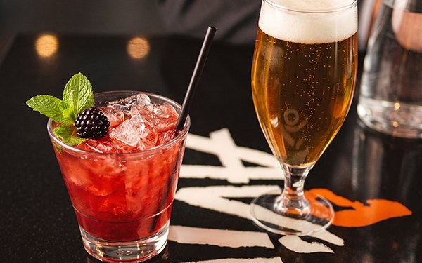 Avivo craft cocktail and beer on the branded tabletop